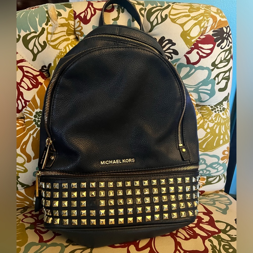 Michael Koors navy blue studded back pack, blue leather and gold hardware.